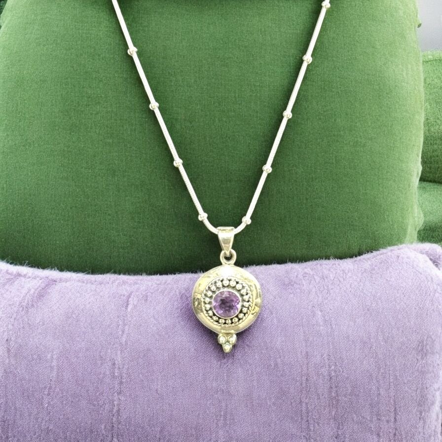 Solid round casting pendant with  amethyst stone