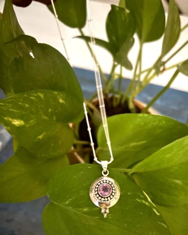 Solid round casting pendant with  amethyst stone