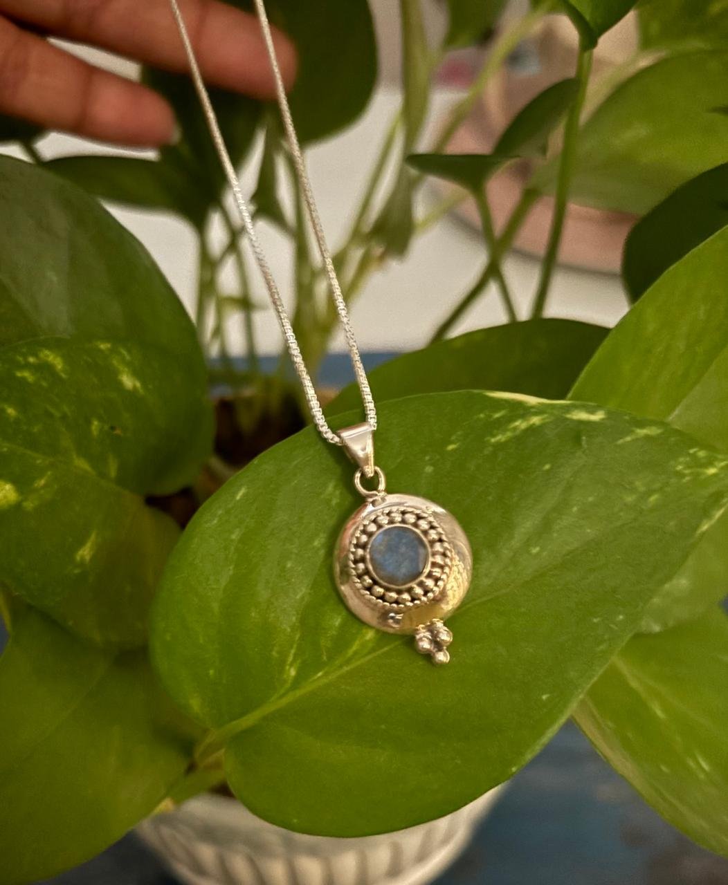 Solid silver casting pendant with blue topaz stone