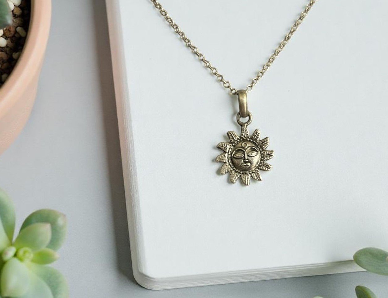 Bronze sun face charm necklace