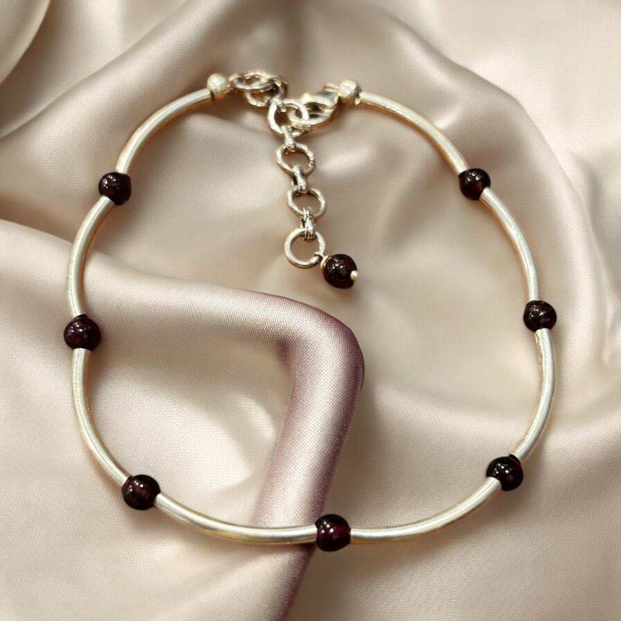Garnet beads in silver chain bracelet