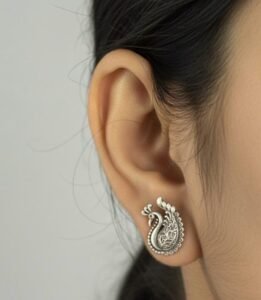 Exquisite silver peacock studs in intricate design