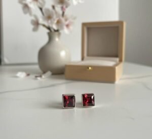 Garnet Red princess cut studs in 925 silver